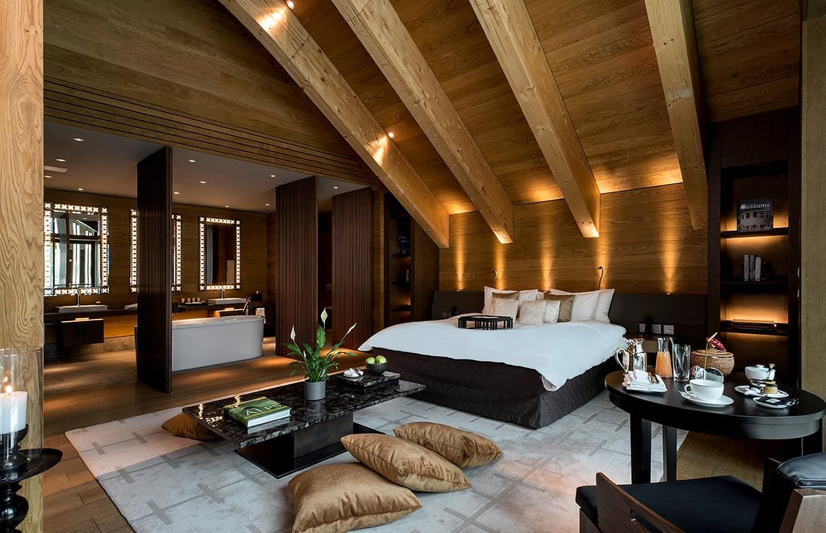 The Chedi Andermatt, Switzerland suite with wooden beams
