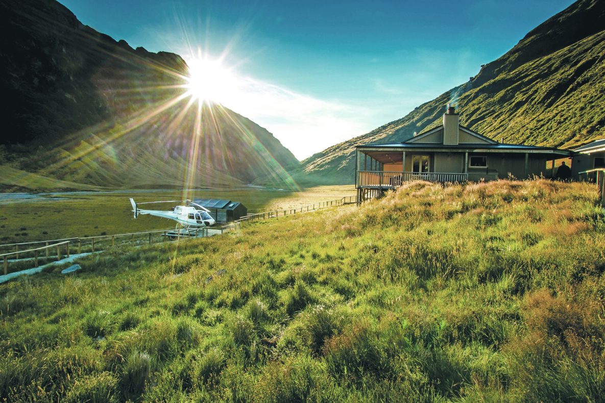 Minaret Station Alpine Lodge,New Zealand,exterior with helicopter and mountains